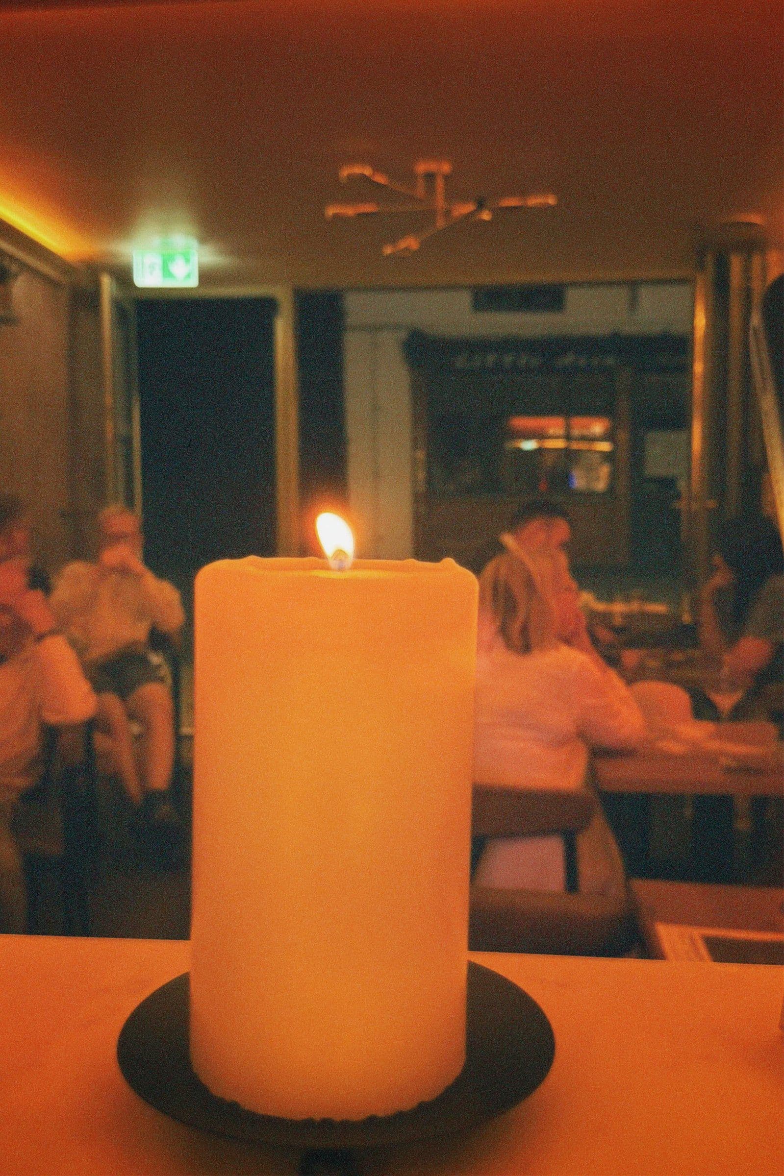 A candle burning in the room at Brume